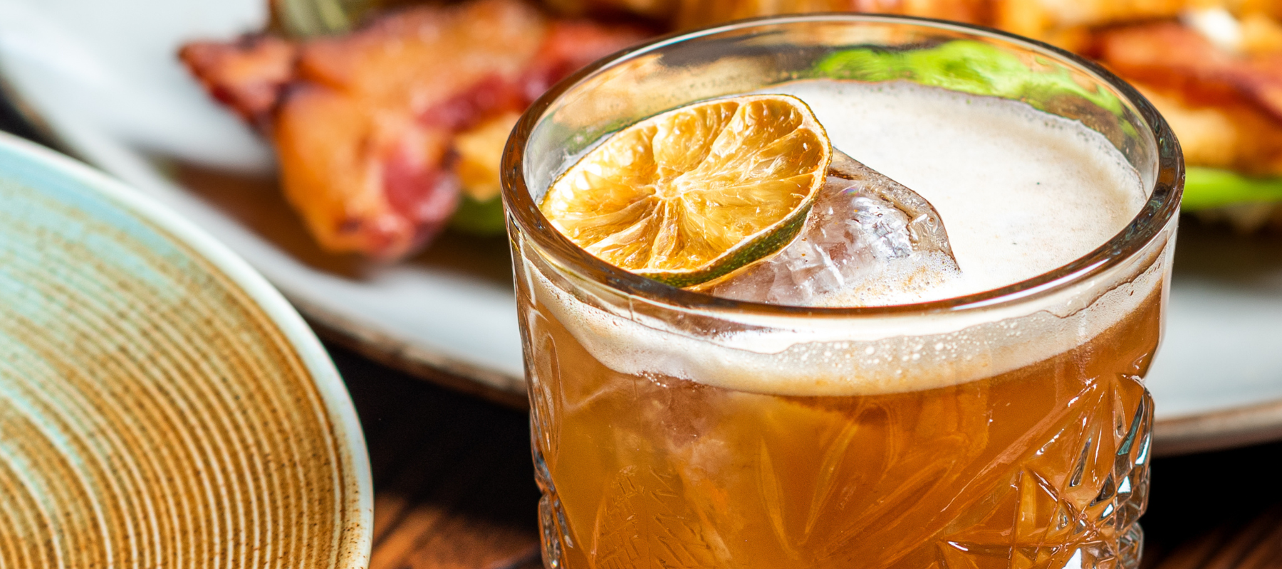 Pass the Tea punch with lemon slices in a large punch bowl