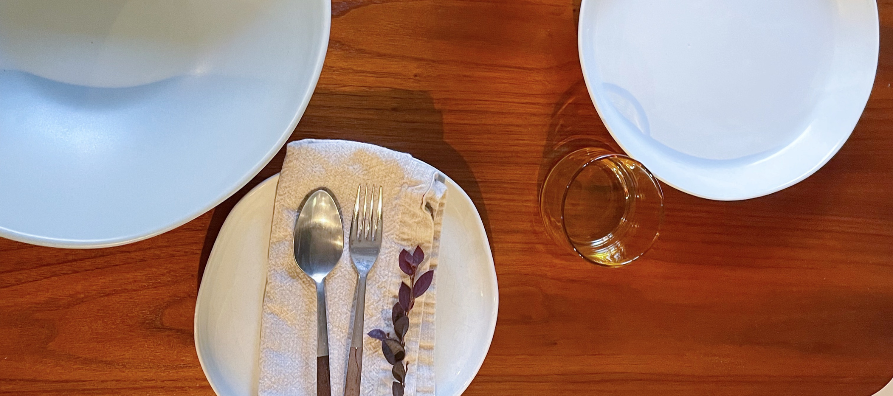 plates arranged on the table and cutlery