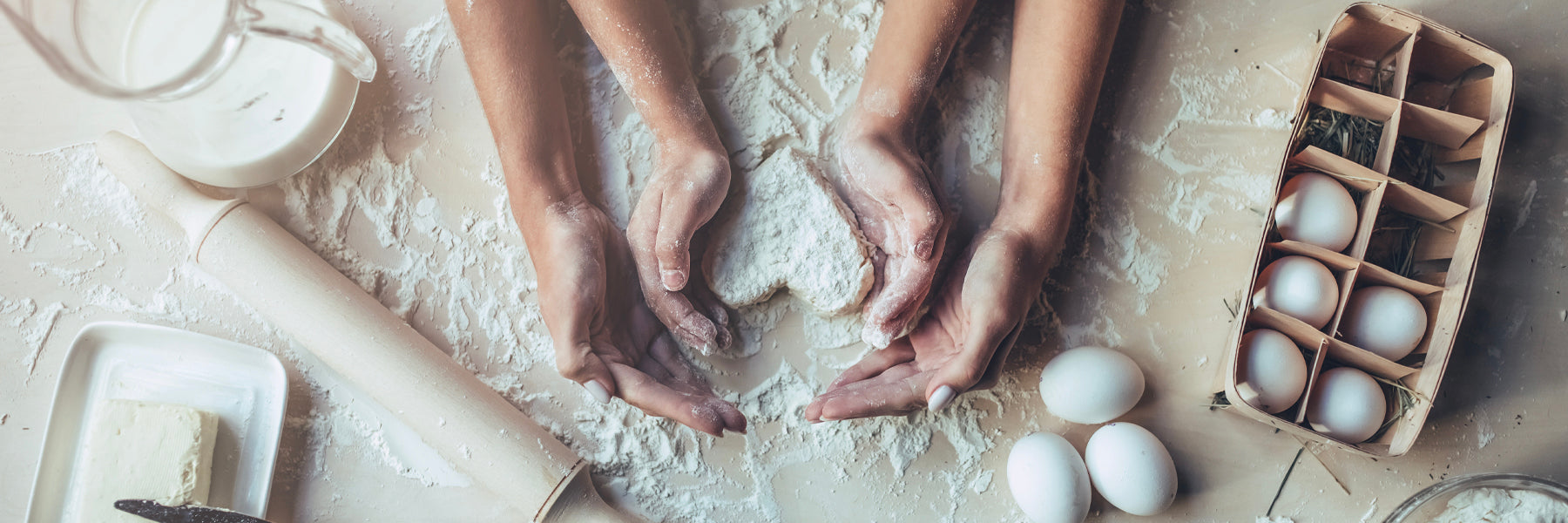 Mother and child shaping bread in kitchen: Mother's Day food gifts