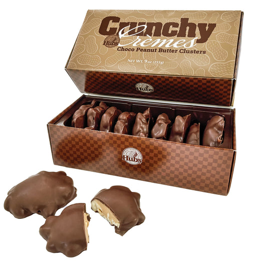 Box of Crunchy Cremes Choco Peanut Butter Clusters with a few pieces displayed in front on a white background.