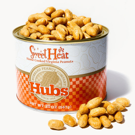 Can of Hubs Sweet Heat Virginia Peanuts with peanuts spilling out on a white background