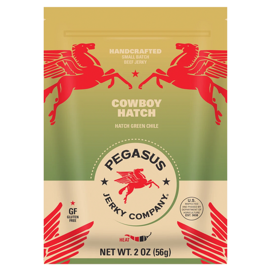 A 2 oz bag of Pegasus Jerky Company's Cowboy Hatch Hatch Green Chile jerky. The packaging features a gold and olive green background with red Pegasus illustrations and white text.